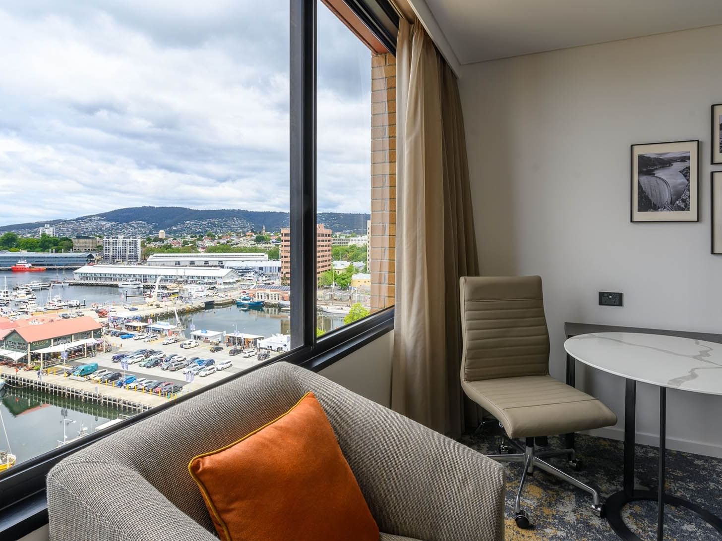 Lounge area by the window in Standard Harbor room at Hotel Grand Chancellor Hobart