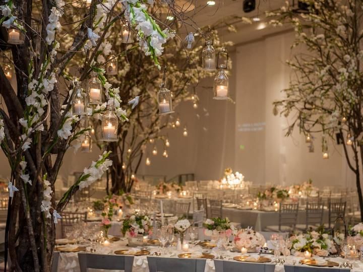 Decors with candles & tables in an indoor wedding at FA Hotels