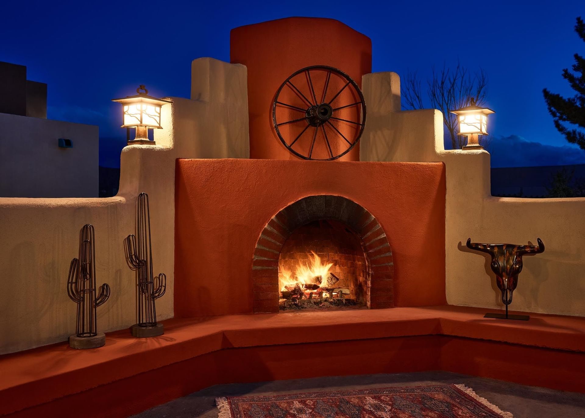 outdoor stone fireplace at night