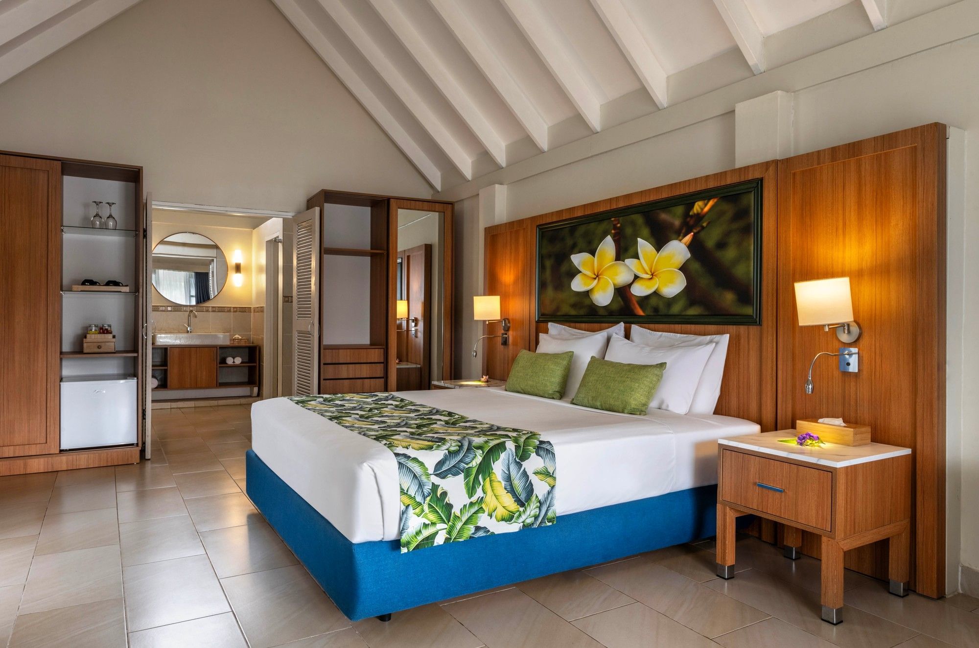 Elegant bedroom with tropical decor and modern furnishings at Warwick Le Lagon Resort and Spa Vanuatu Redesign.