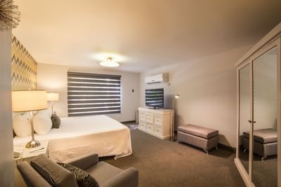Double bed and TV in Master Suite at Araiza Hotel Calafia