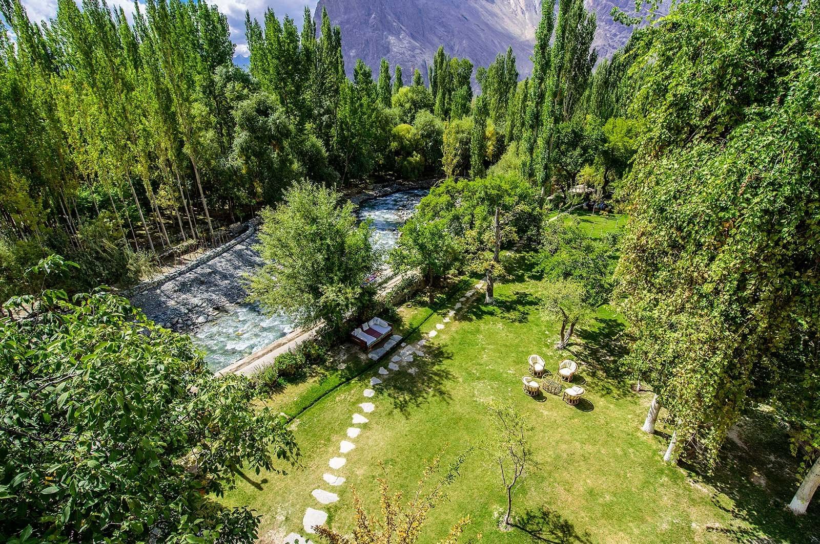 A distant view of the hotel garden at Shigar Fort Residence