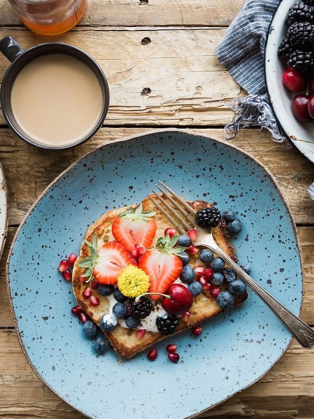 Breakfast dishes with fruits near Sebel Quay West Suites Sydney