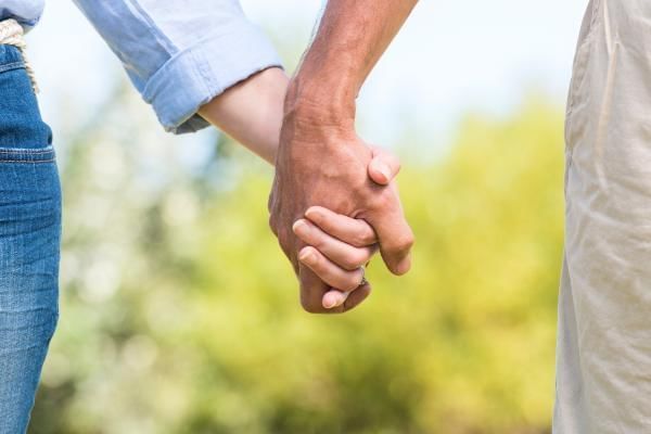 Married couple hand in hand on their second romantic honeymoon in the UK