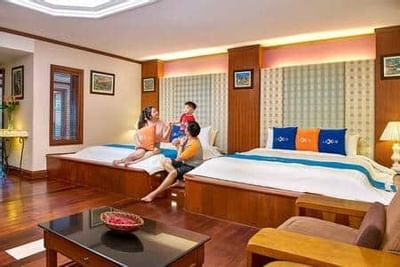 Family enjoying quality time in spacious Grand Pool Villa (Upper Unit) room – Grand Lexis Port Dickson