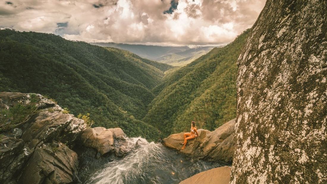 A woman in Windin Falls near Pullman Palm Cove Sea Resort