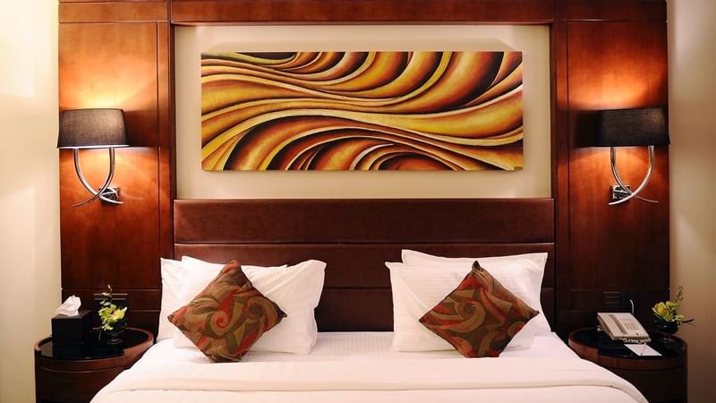 Art hung by the king bed in Deluxe Room at Al Hamra Palace by Warwick Riyadhd