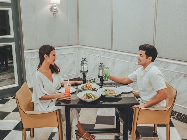 Couple having dinner at U Hotels and Resorts