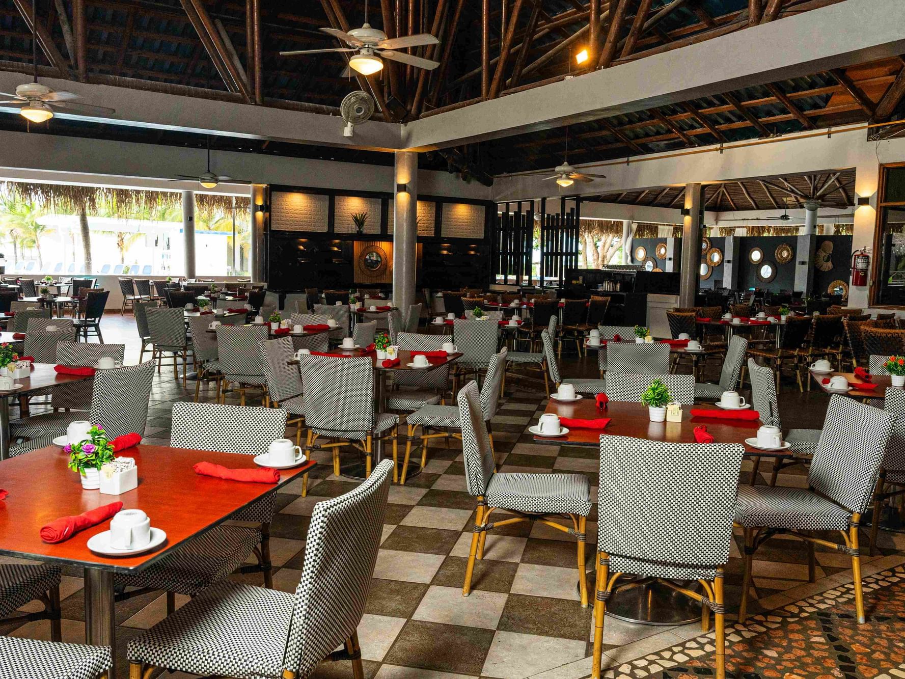 Panama Canal Buffet Restaurant of the Playa Blanca Beach Resort & Hotel with numerous tables.