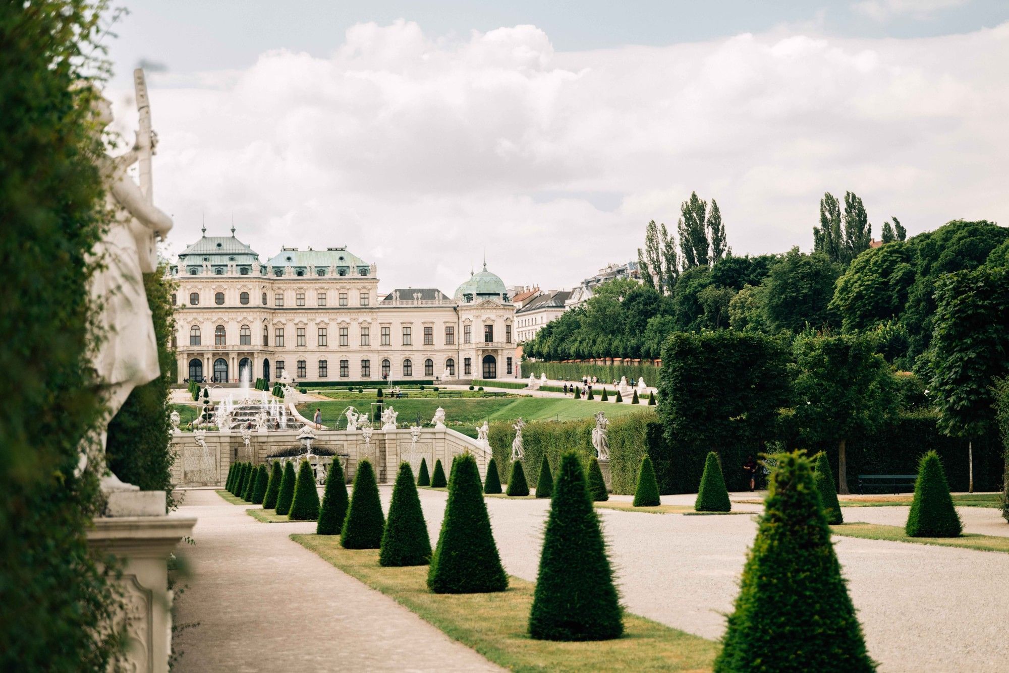 View of the baroque Belvedere Palace in Vienna with manicured gardens, fountains and symmetrical hedges