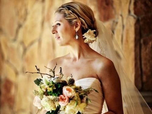 A beautiful bride in a white dress at Stein Eriksen Lodge