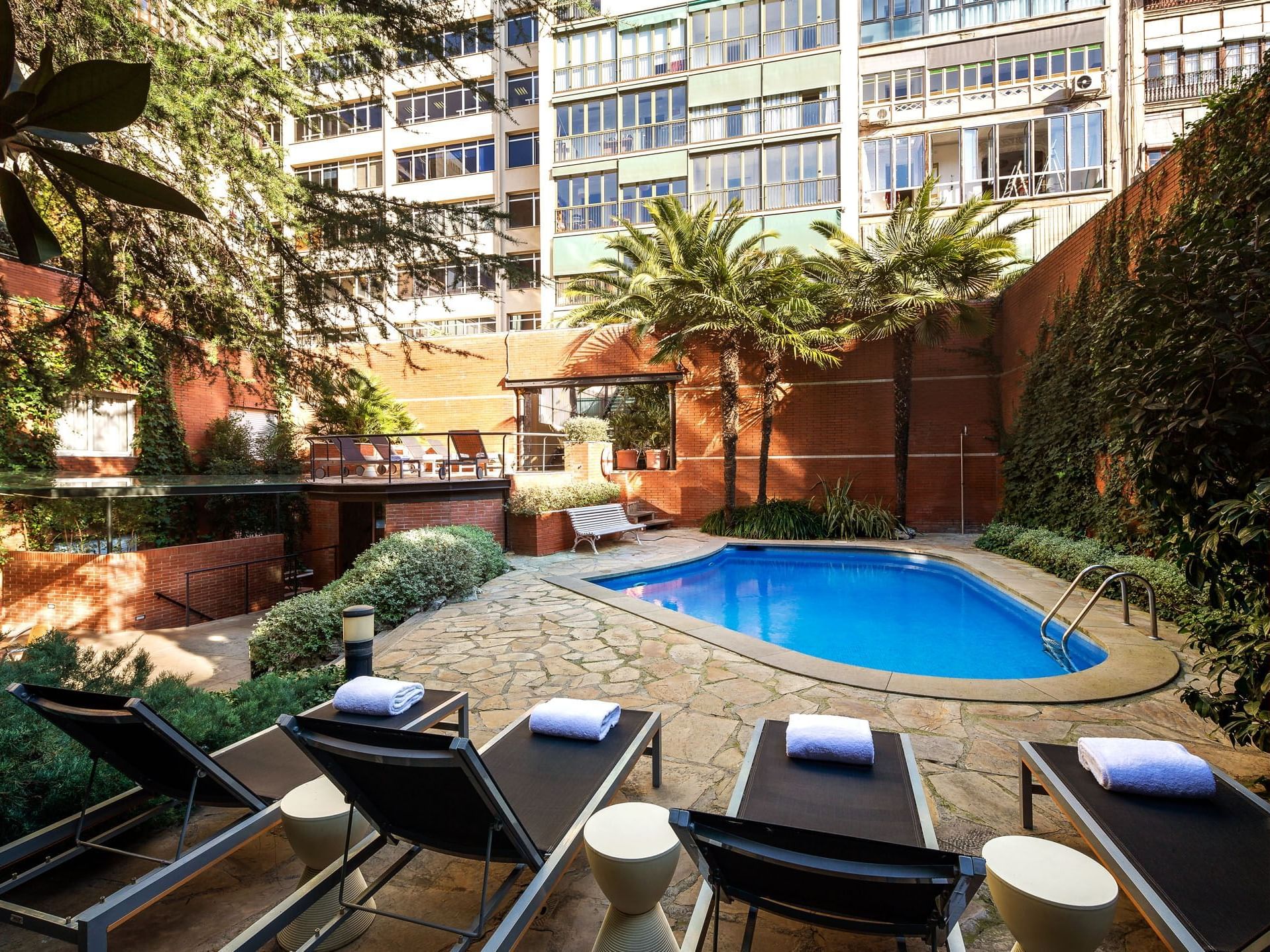 Swimming pool with lounges at Barcelona Balmes Residence