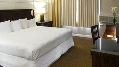 large white bed in hotel room