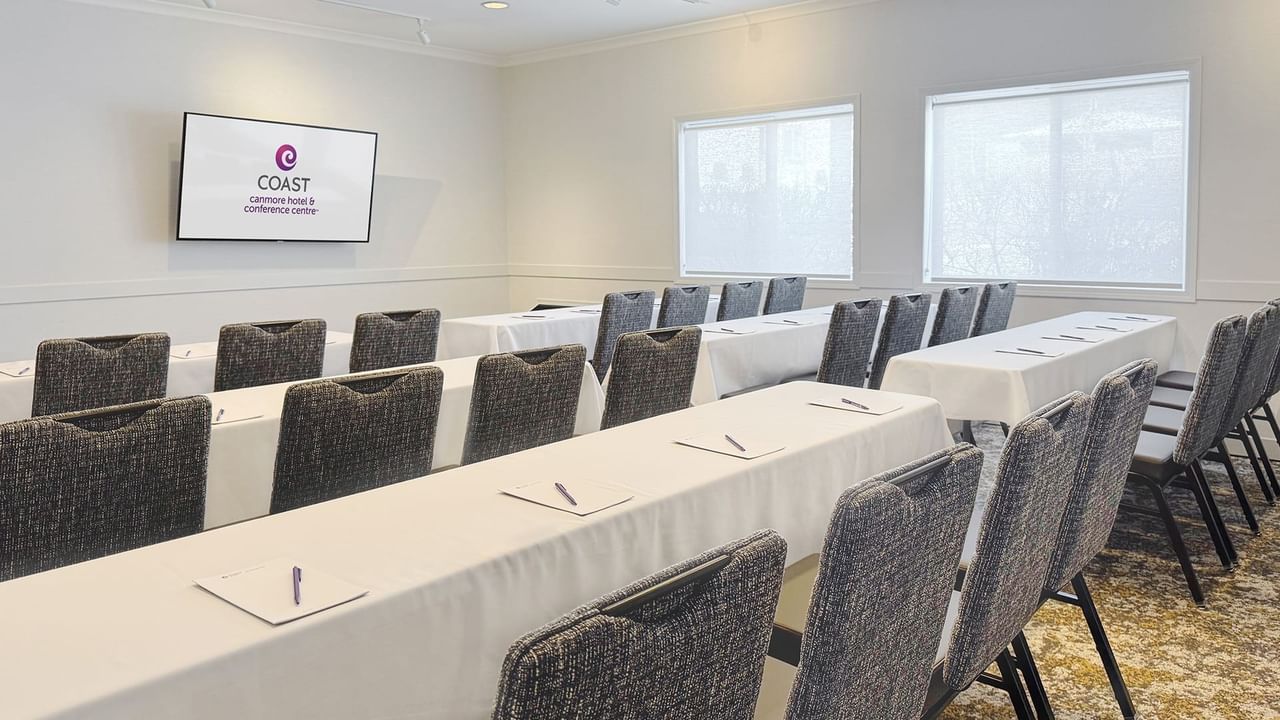 A conference room with long tables.