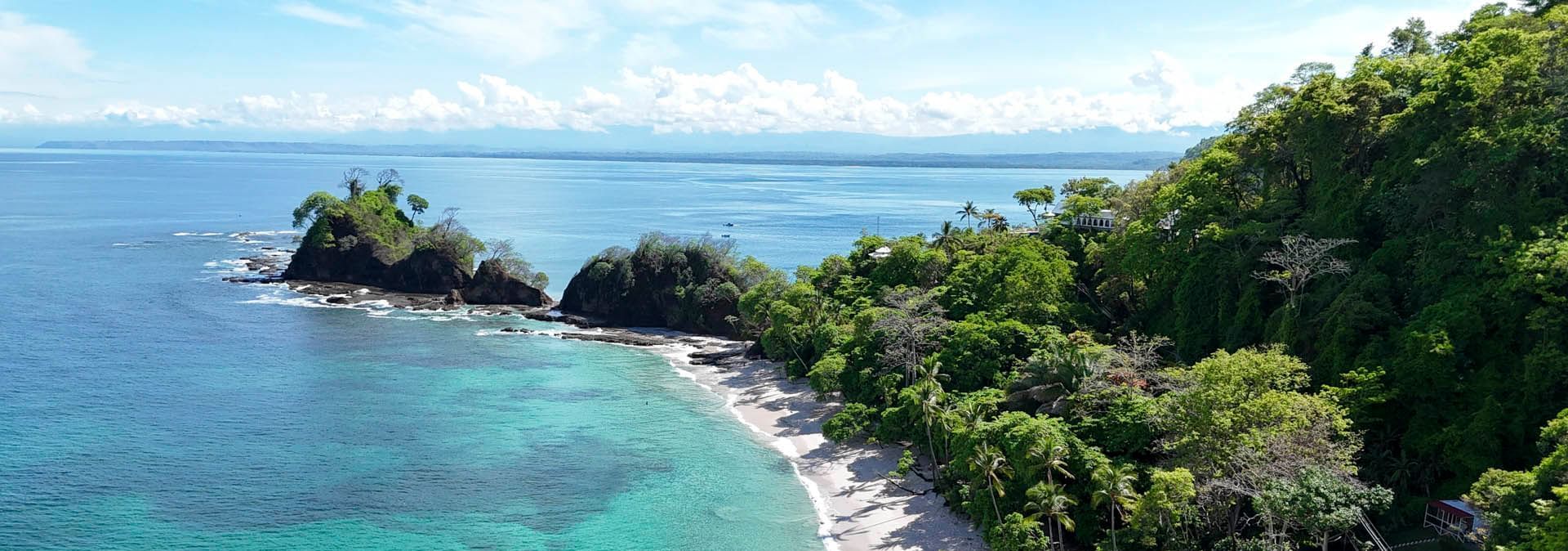 Aerial view of Playa Blanca with lush greenery near Punta Leona Beach Club & Nature Resort