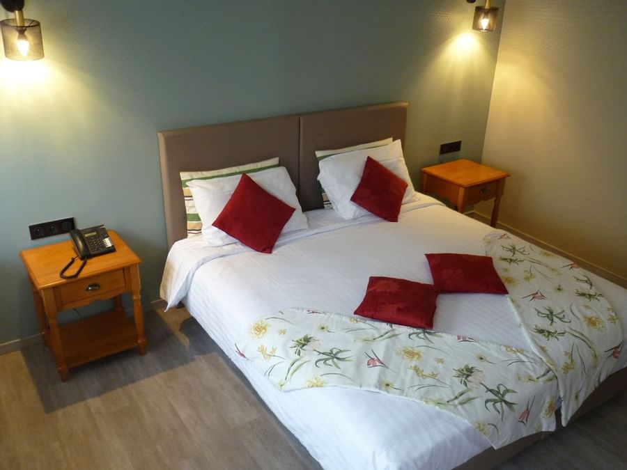 Terrace Double bedroom with a king bed at The Originals Hotels