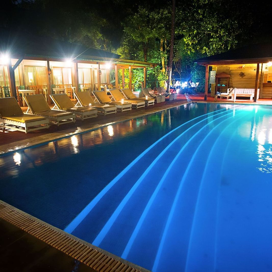 Outdoor pool area & pool beds at La Cantera Lodge De Selva