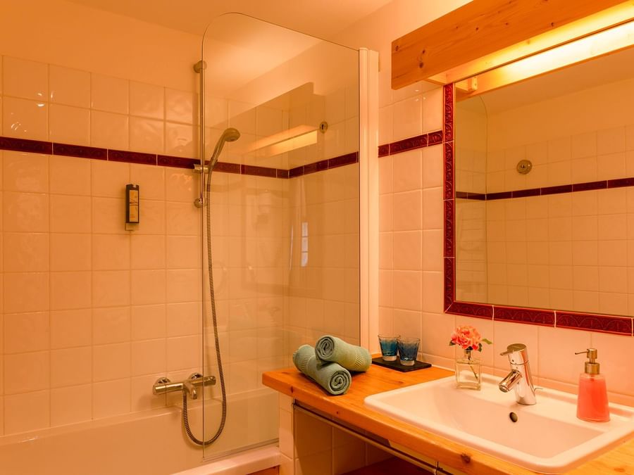 Bathroom vanity in bedrooms at Chalet-Hotel La Ferme du Chozal