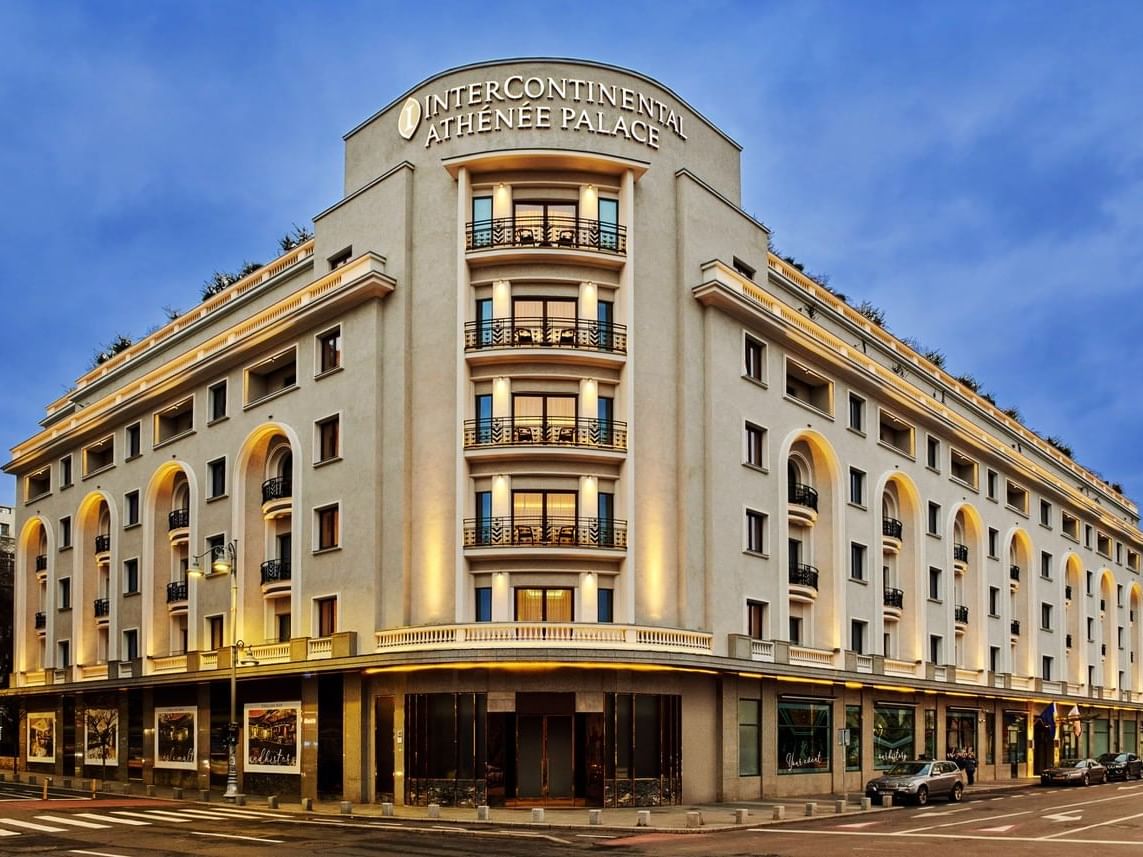 Exterior of Athenee Palace Hilton Bucharest at night near Ana Hotels