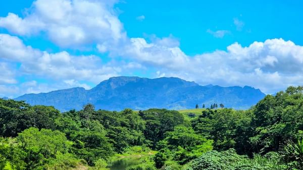 Lush green valley with a river and mountains in the Garden of the Sleeping Giant near TokaToka Resort Nadi Fiji