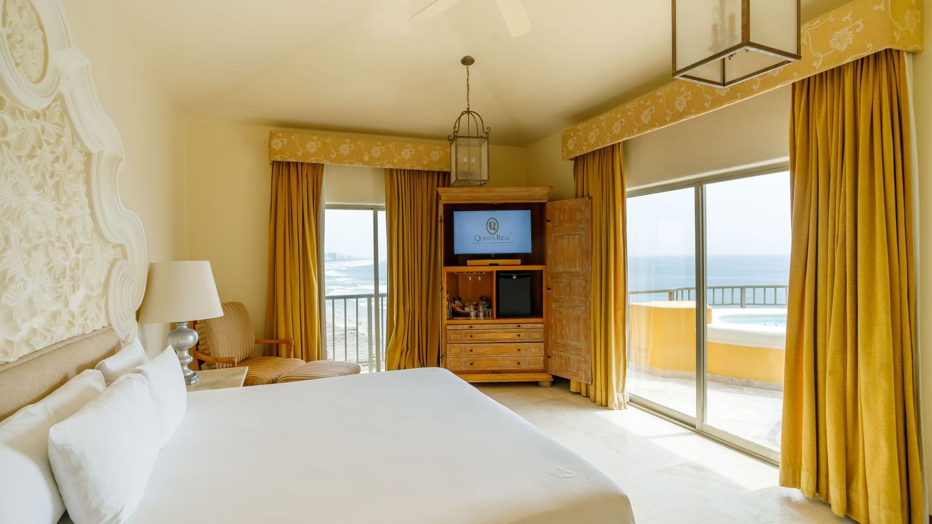 King Governor Suite with a balcony hot tub, ocean panorama, and traditional Mexican decor at Quinta Real Acapulco