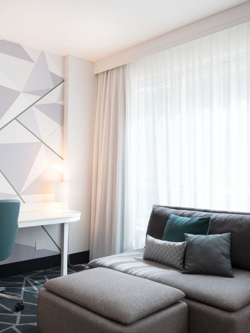 Premium loft Suite with a sofa bed and work area near the window at Warwick Le Crystal Montreal