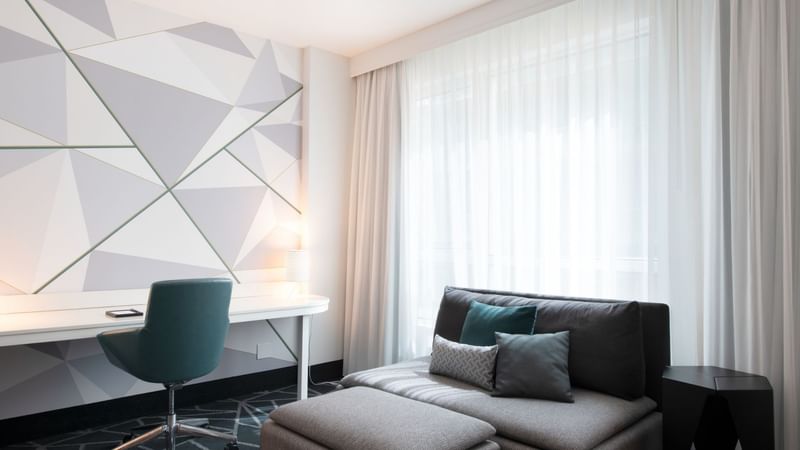 Premium loft Suite with a sofa bed and work area at Warwick Le Crystal