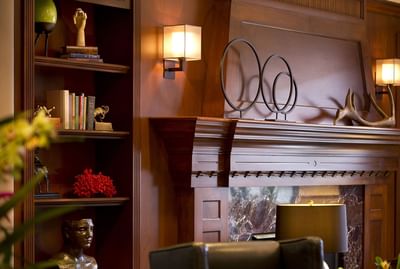 Book shelf by a fireplace in the lounge area at Paramount Hotel Seattle