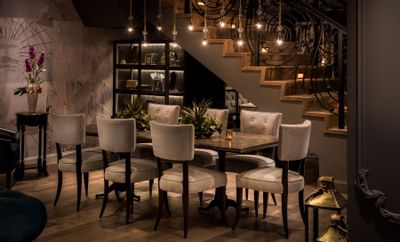 tables and chairs with flowers