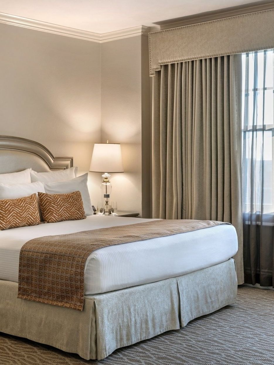 Classic King Accessible room at Warwick Melrose in Dallas with elegant decor and large window.