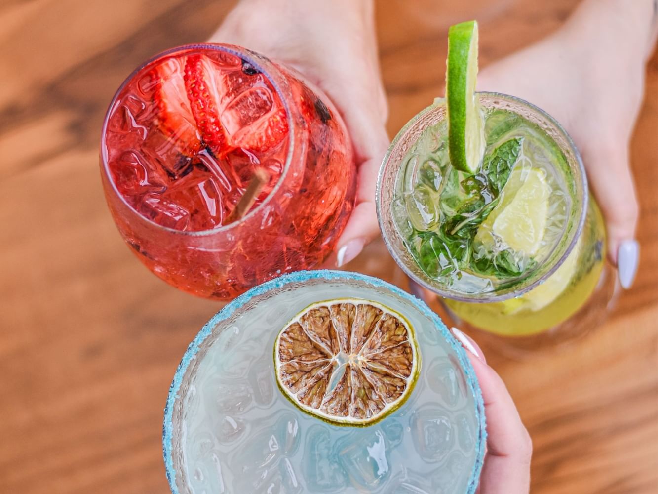 Red strawberry drink, a green mojito, and a blue margarita served in Sépalo Restaurante at Best Western Jaco Beach