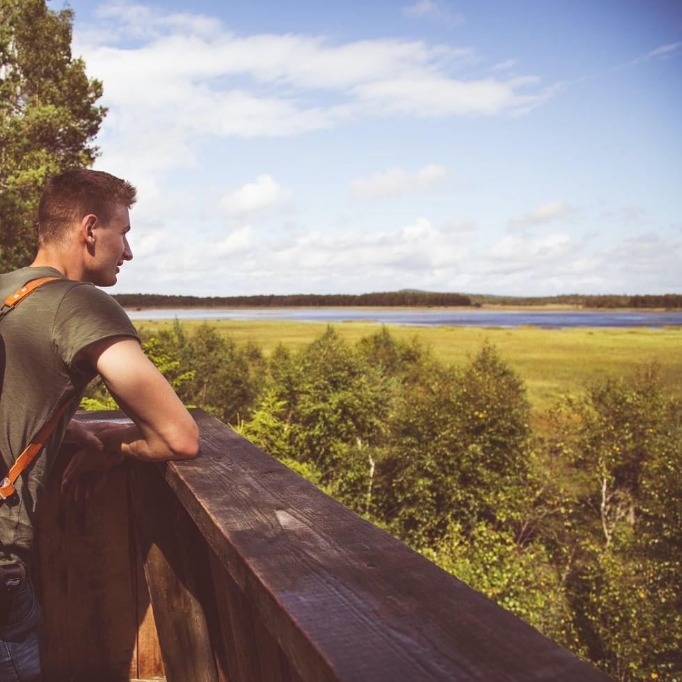 Man on Burgauberg observation tower near Falkensteiner Hotels