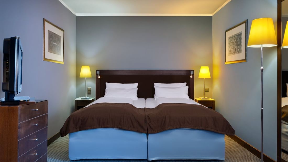 Twin beds in Comfort Room at Flemings Selection Hotel