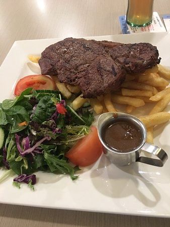 Steak & fries dish served at Nesuto The Entrance Apartment