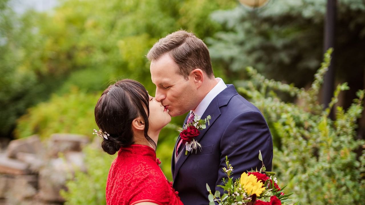 Bride and groom kissing.