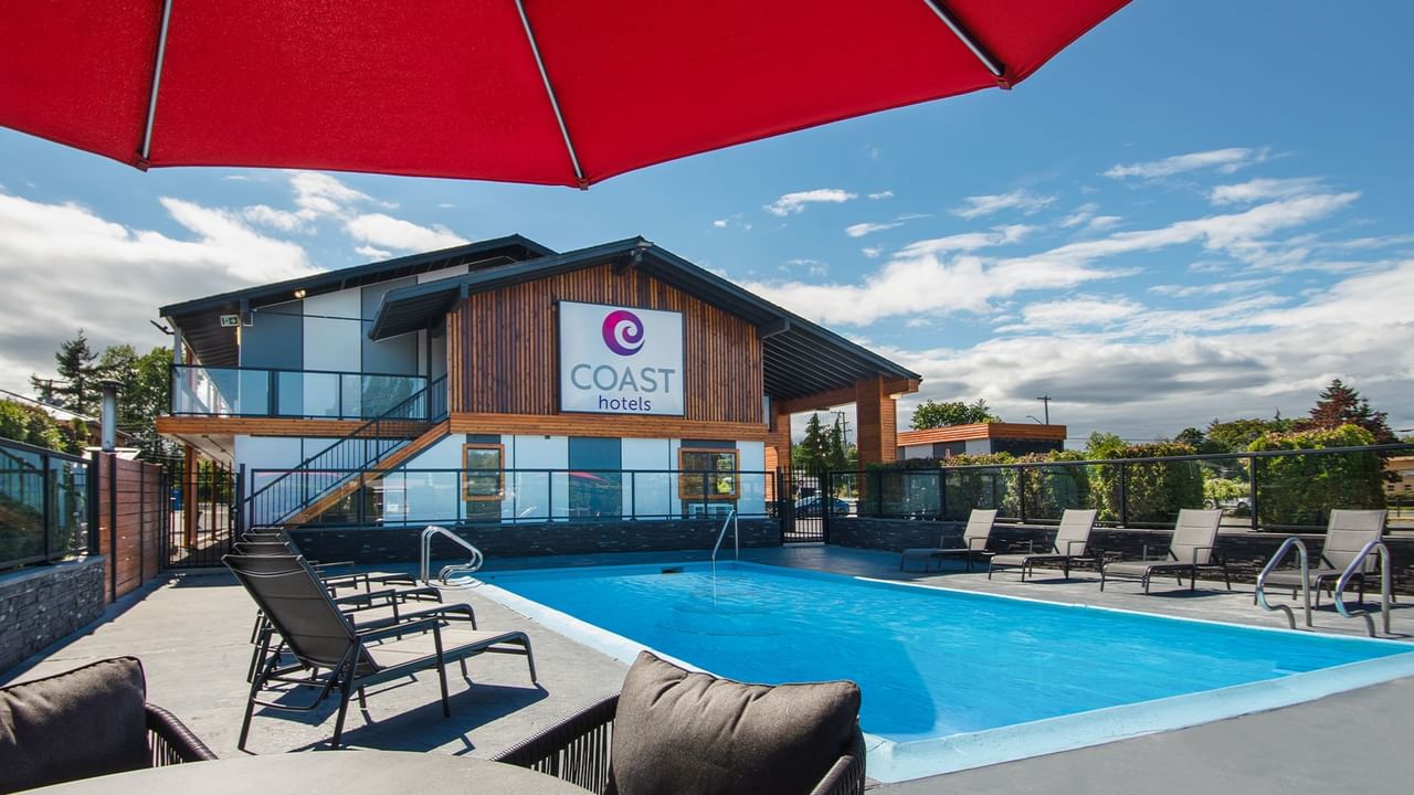 Hotel outdoor pool and lounge chairs