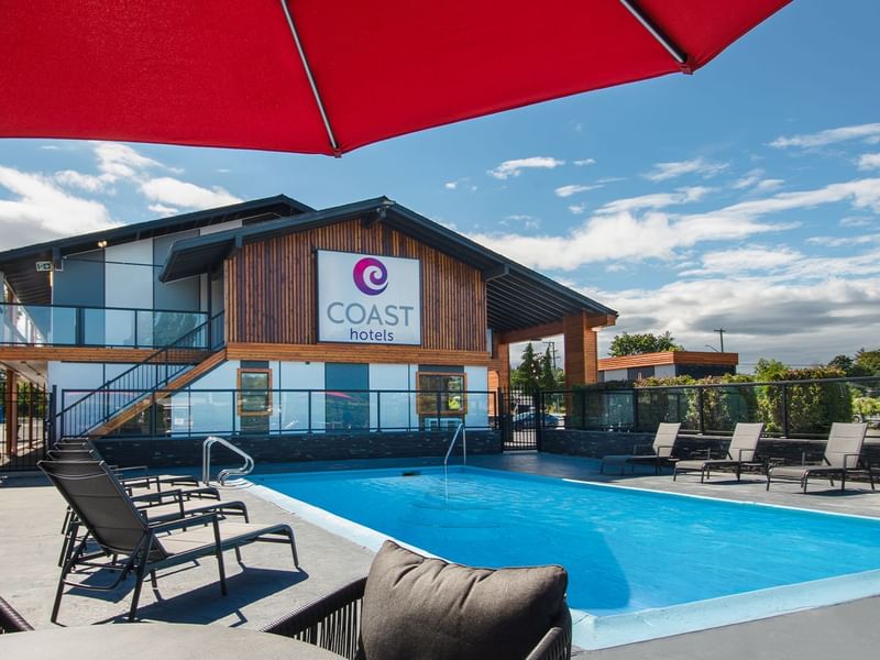 Hotel outdoor pool and lounge chairs