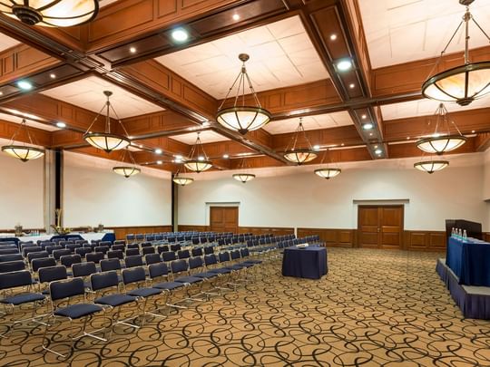 Camino Real event space with patterned carpets and classic hanging lamps at Camino Real Puebla Angelopolis