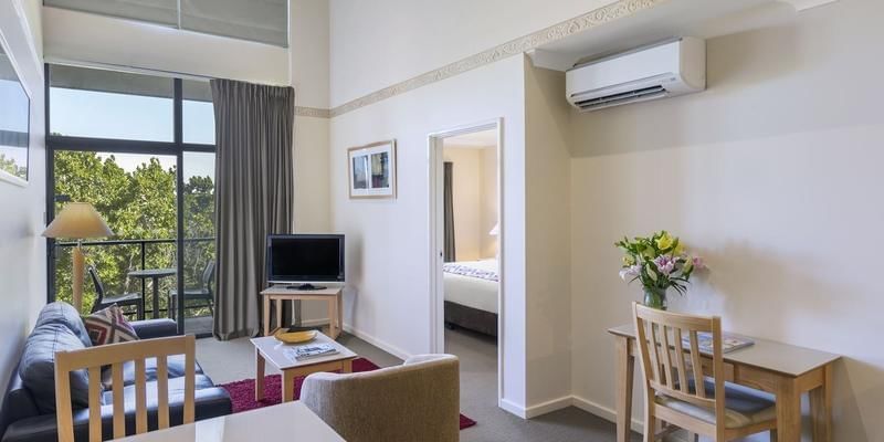 Balcony & living room area in a Room, Nesuto Curtin Perth Hotel