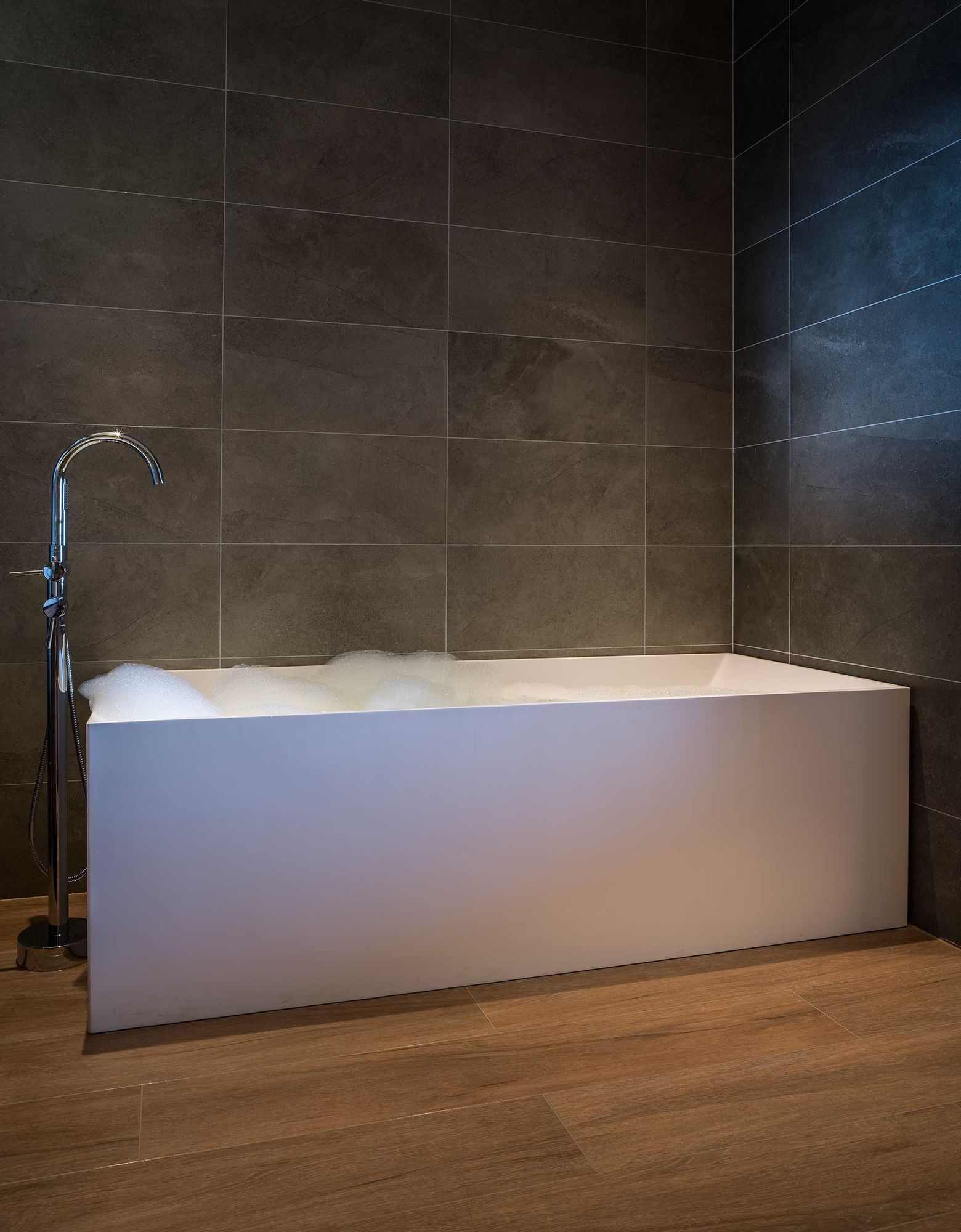 Bathtub in a room at Golden Rock Resort