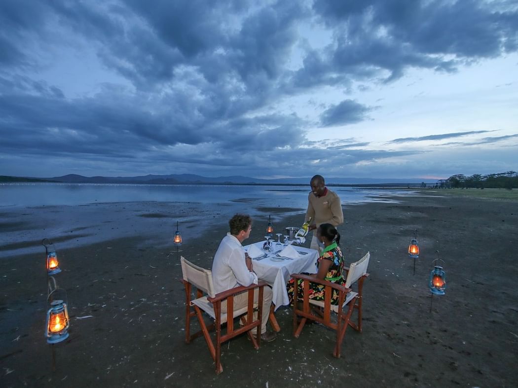 Dinner setting by the lake at Hotel Lake Elmenteita