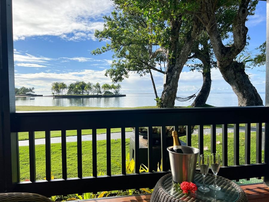 Bottle of wine in bucket with two glasses on a balcony at The Naviti Resort - Fiji.