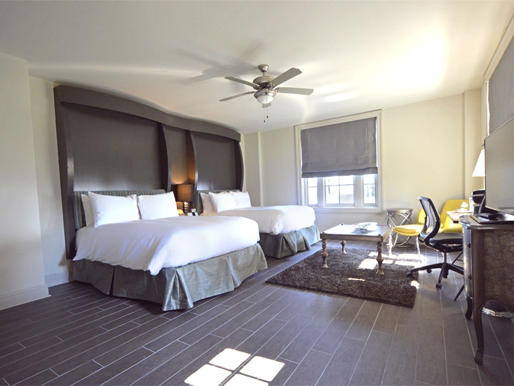 Two Queen Beds, Gulf View at The White House Hotel, with two queen beds, dark headboards, wood floor, and ceiling fan