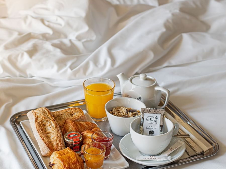 Breakfast tray served in a room at The Originals Hotels