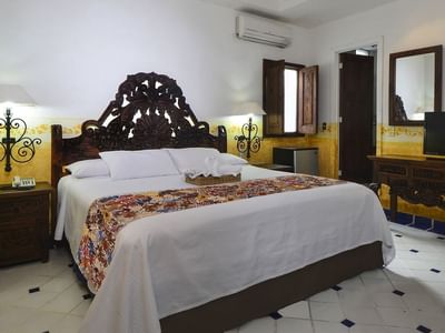 King bed & TV stand in Standard Room at Casa Dona Susana