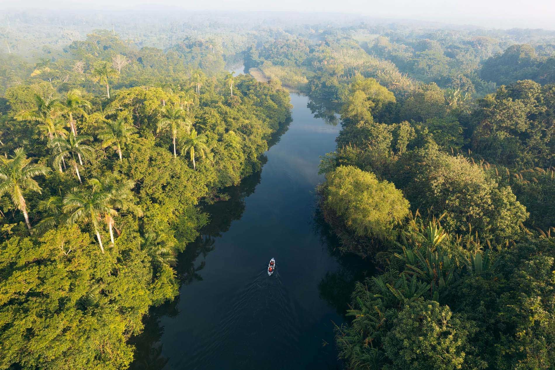 Aerial view of a narrow river through tropical forest near Indura Beach & Golf Resort