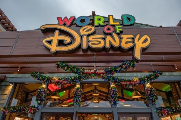 Storefront of World of Disney at Disney Springs during the holidays.