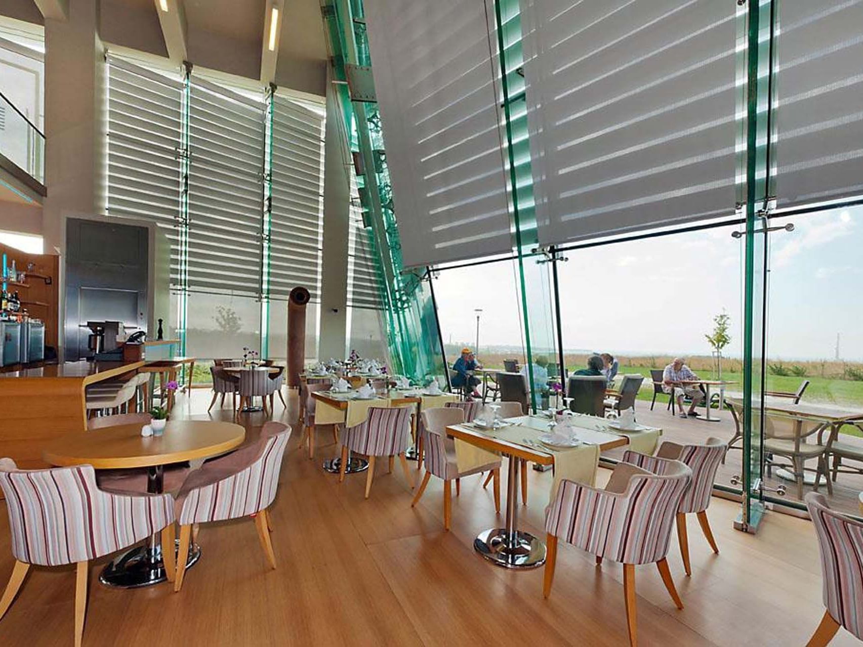 Interior of dining area with large windows in Lobby Restaurant & Bar at Titanic Anadolu Gebze