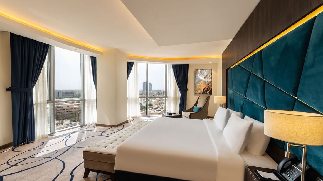 Cozy bed with city view in Panorama Suite at Warwick Riyadh