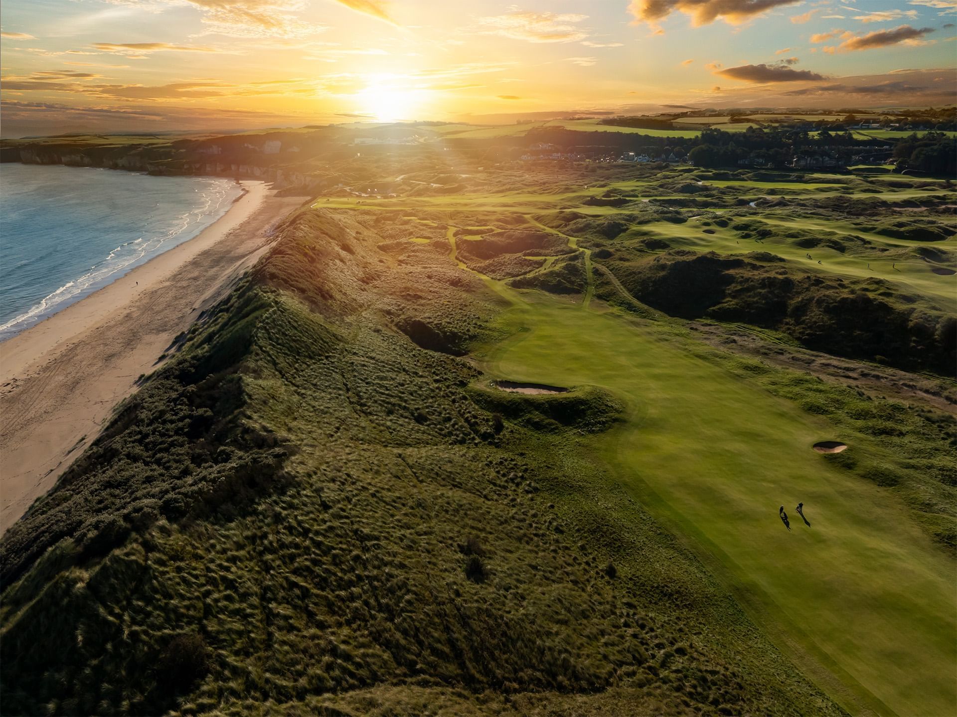 Portrush golf court by the sea in sunset near Dunluce Lodge